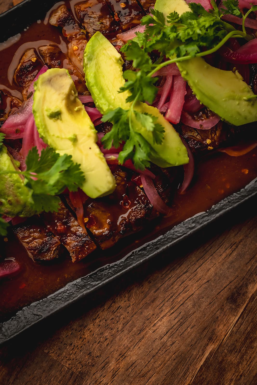 Ribeye aguachile with avocado and pickled onion