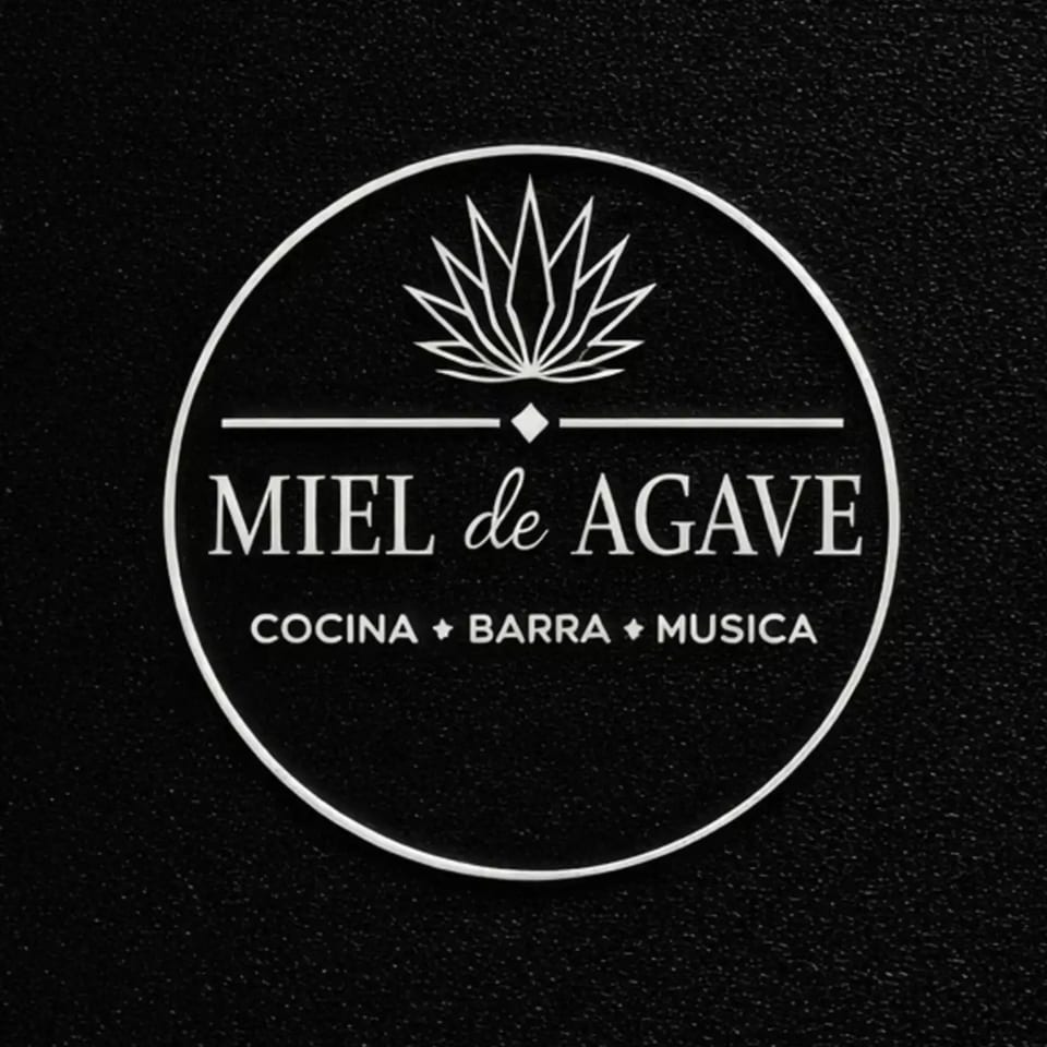 Miel de Agave restaurant logo, a white circle with agave plant, text, and diamonds on black.